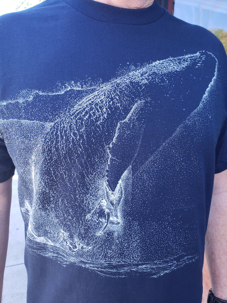 David Dory modeling his Tee shirt featuring The star whale and four mermaids in the wash from the breaching humpback whale constellation in the David Dory painting "Star Breach at Sunken City, San Pedro" used for the 2019 Los Angeles Fleet Week Poster.